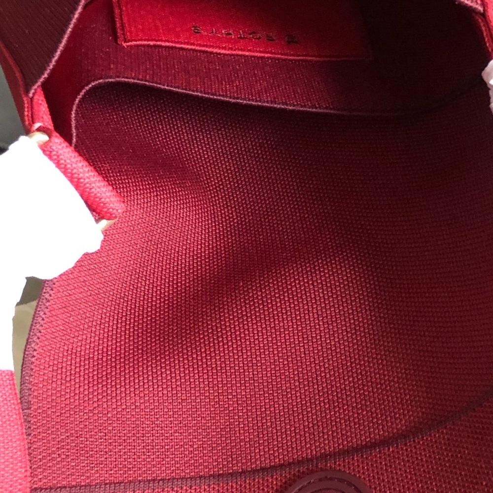 Rothy’s NWT Ruby Red Saddle Bag.